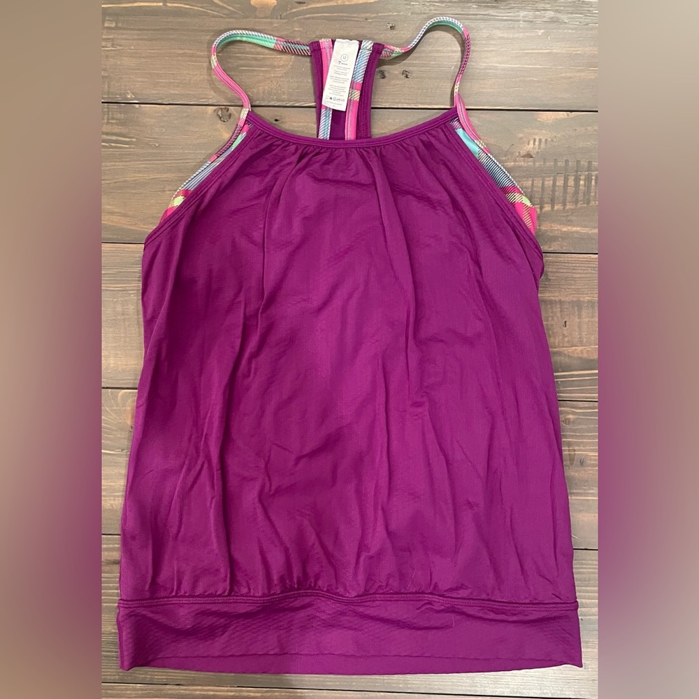 Ivivva by Lululemon tank top. Built in shelf bra. Great condition! Size 12.